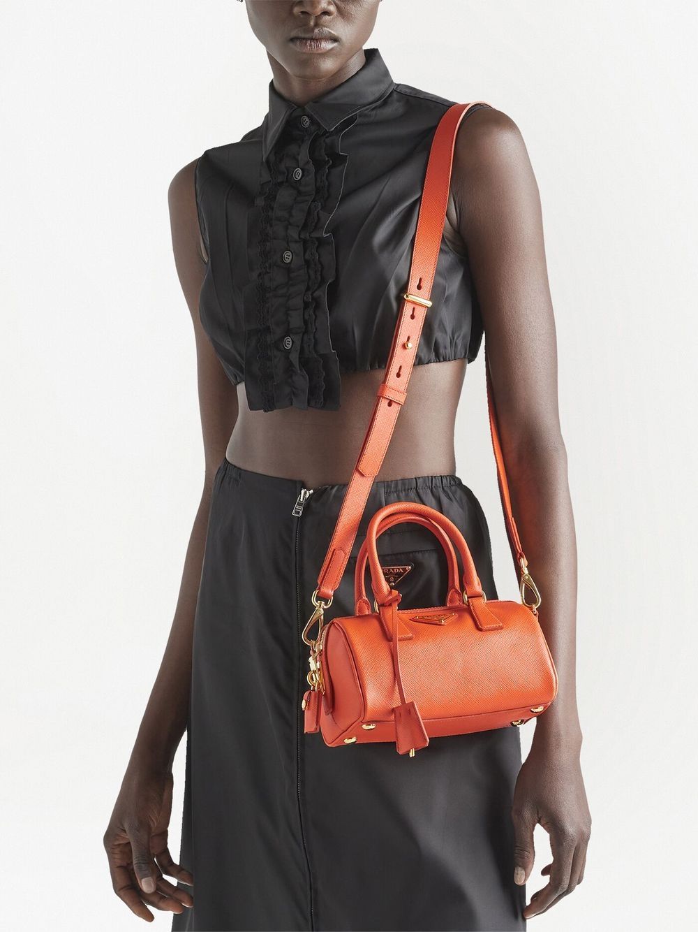 Pra*a triangle-plaque leather mini bag