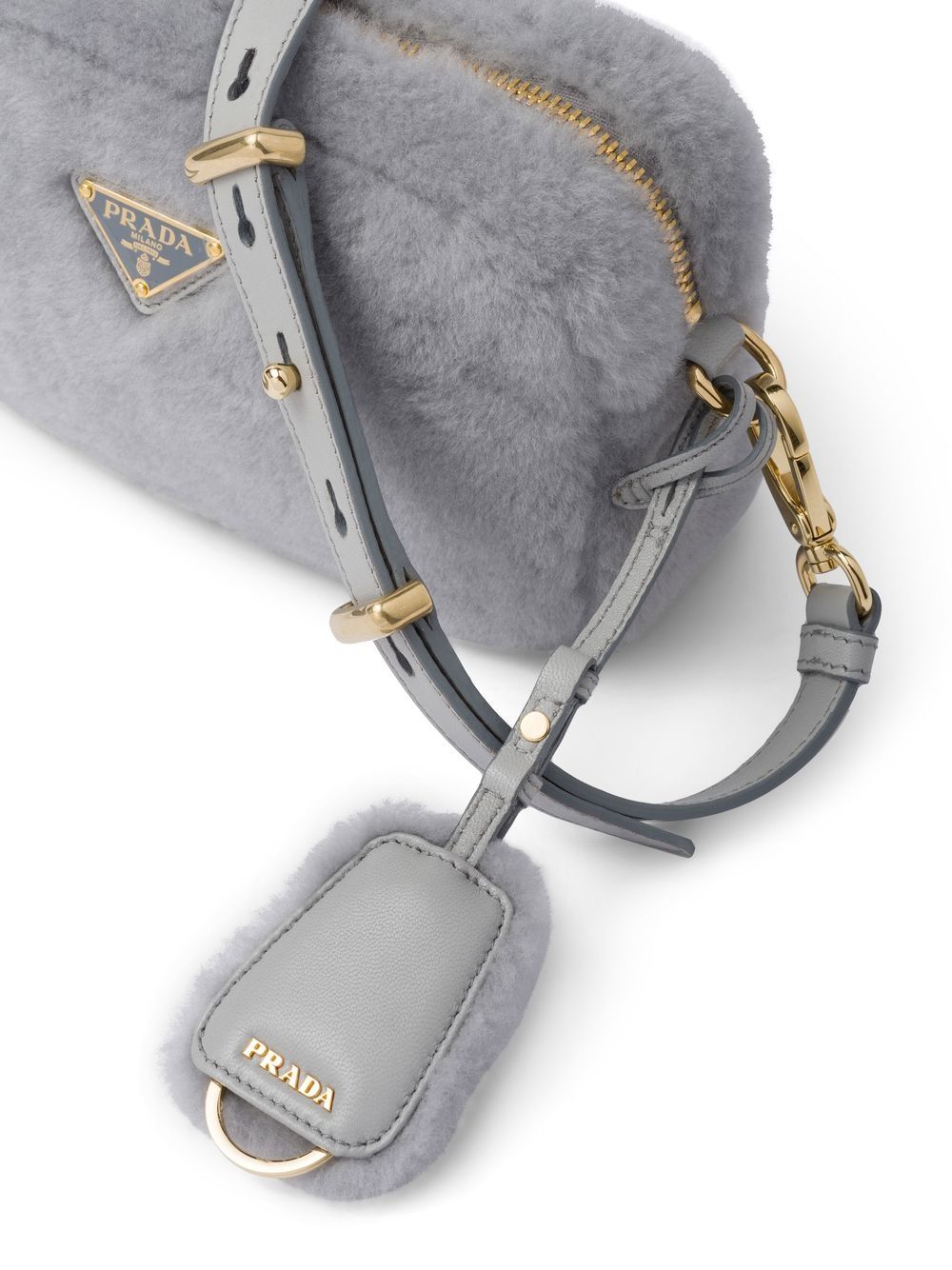 Pra*a triangle-plaque shearling shoulder bag